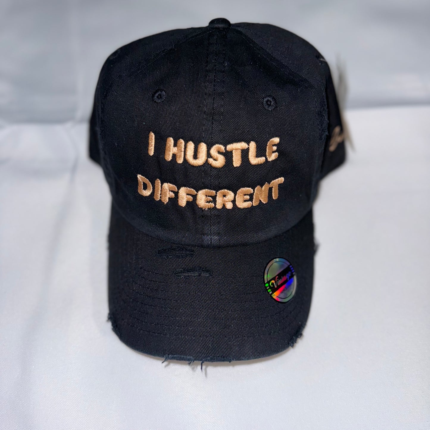 “I HUSTLE DIFFERENT” DISTRESSED HAT